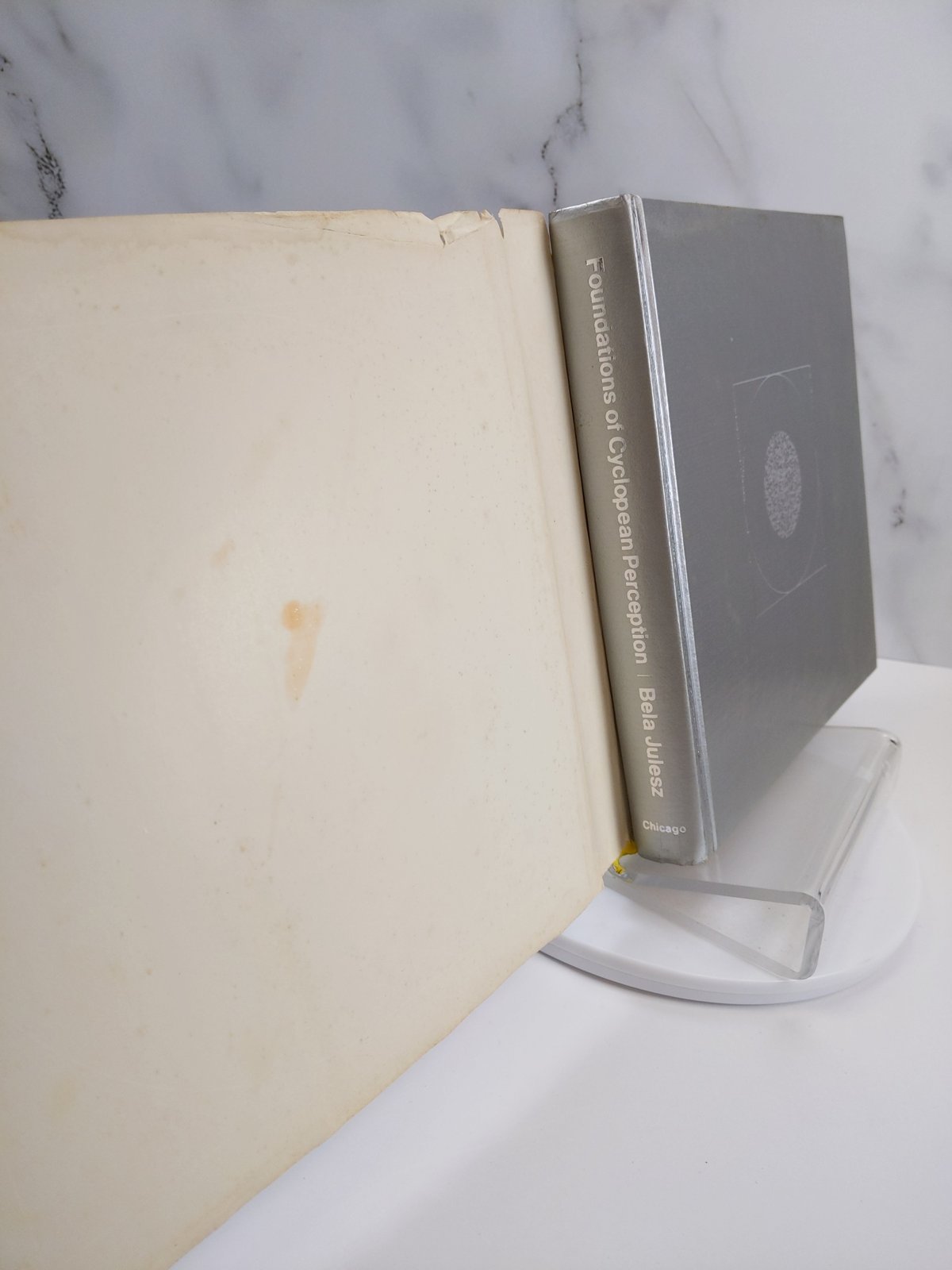 front endpaper and the silver cloth boards under the jacket